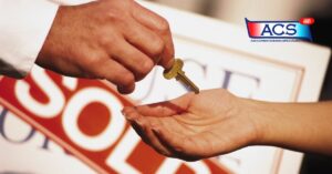 man handing key to new home owner