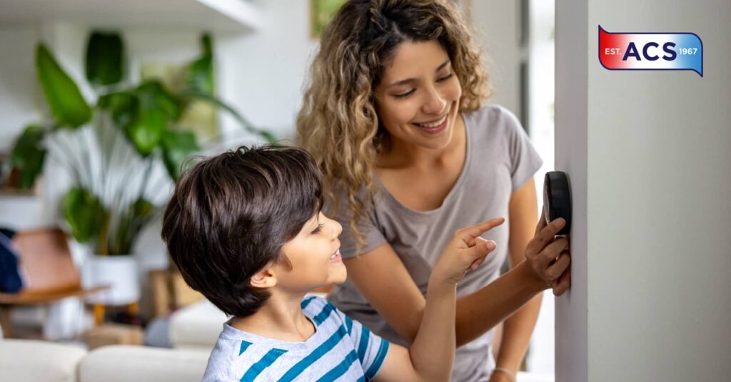Mother and son checking thermostat